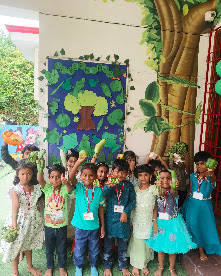 Children dressed in green celebrating Green Day at Mrs Reena's Cocoon Play School